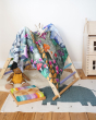 Wonderie sensory play cloth, Enchanted Toadstool Forest, draped over a Triclimb frame