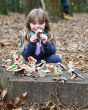 Lanka Kade wooden bird toys, in a woodland setting