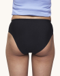WUKA Teen Stretch Bikini Brief Period Pants from the back, on a cream background