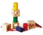 Naef Signa wooden threading toy partially assembled on a white background. Shows 4 wooden cubes and 4 wooden cylinders with thread weaving through holes in the wood.