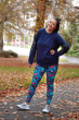 Woman stood in a park wearing the Frugi eco-friendly adult cosmo leggings