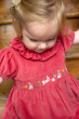 close up of a girl wearing frugi amilie party outfit