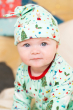 Close up of baby wearing the Frugi eco-friendly arctic aqua babygrow and knotted hat