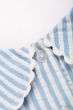 Close up of the neck button closure on the Frugi Beach Hut Blue and white Stripe Cassie Collared Dress