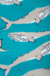 Close up of print on the Frugi Switch Snuggle Suit - Camper Whales