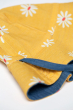 close up of the denim print on the Frugi Chambray Bumblebee Yellow Daisies Helen Reversible Hat 