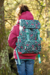 Frugi dala ditsy trail blazing backpack worn on a childs back