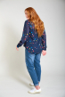 Woman wearing Georgette nursing & maternity blouse by Frugi from back on grey background