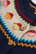 close up of frugi kenna cardigan fairisle robin pattern