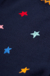 close up of frugi kenna cardigan star pattern on navy backgroubd