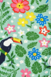 A close up of the bird and flower tropical print on the Frugi Children's Organic Cotton Libby Printed Leggings - Tropical Birds. A fun, tropical bird and flower print leggings on mint green fabric. On a cream background