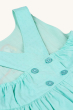 The back of the Frugi Organic Phebe Party Dress - Spring Mint / Macaw, showing the button fastenings and elasticated back. On a cream background