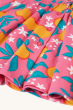 A closer look at the twirly skirt and button fastenings on the Frugi Organic Lettie Dress - Orange Blossom