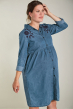 Woman wearing Frugi Mila chambray long sleeve shirt dress with navy embroidered flowers on the shoulders touching her hair