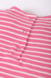 Close up of back popper closure on the Frugi pink breton stripe dog Little Layla Dress