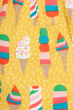 Close up of the print on the Frugi Dara Baby Body Dress with a yellow Rainbow Sprinkles design 
