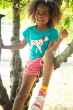Child wearing the Frugi Sophia Slub camper blue dalmatian T-Shirt
