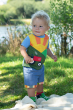 Child wearing the Frugi Sunshine Tractor Lori Printed T-shirt with chambray shorts 