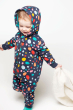 child wearing a Frugi Switch Snuggle Suit with Indigo Dalmatian print 
