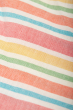 close up of the rainbow coloured stripes on the Frugi Tallulah Beach Stripe Trapeze Dress 