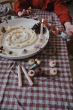 close up of a child playing with grapat candles and waldorf kingdom elements on the festive table