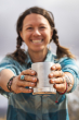 An adult holding the Stainless Mountain Klean Kanteen 12oz Insulated Camping mug in their hands