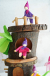 Magic Wood pose-able felt elves with the log cabin. one is stood at the top, one is sitting 