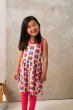 Child wearing a Maxomorra Picnic Tulip Sleeveless Spin Dress