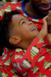 Child smiling happily, wearing  Maxomorra Swedish Santa Pyjamas