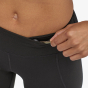 Picture of model demonstrating the key pocket at waistband. Picture background is white.