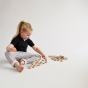 Picture of a child stacking the Abel Mini Re-Wood blocks.