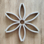 Picture of the Abel Mini Re-Wood blocks placed flat in a flower mandala shape.