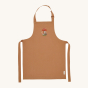 Avery Row Kid's Apron - Woodland Hedgehog. A beautiful light brown cotton canvas apron with a detailed, embroidered hedgehog and mushroom pattern of the chest of the apron. 