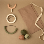 Babai eco-friendly wooden slingshots set laid out on a brown background