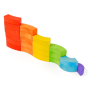 Bajo children's toy rainbow blocks set stacked in a curvy line on a white background