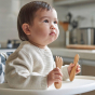 child holding the Bambu Baby Spoon and Fork