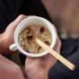 Bambu Long Handle Bamboo Spoon in a cup of cereal
