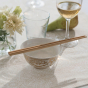 Bambu bamboo chopsticks placed on a small bowl