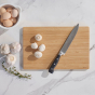 Bambu Undercut Series Cutting Board - Large with kitchen knife and mushrooms on it