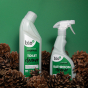  Bio-D 750ml natural toilet cleaner and bathroom cleaner spray bottle on a green back ground with pine cones 
