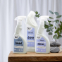 bio-D Bathroom cleaner 500ml, toilet cleaner and limescale remover 500ml, together on a wooden table and green plant in the background