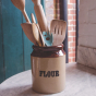 Beco Pets, blue sustainable bamboo spork in a ceramic flour jar with a selection of wooden kitchen utencils.