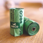 Close up of Beco Pets eco-friendly dog waste bag rolls on a wooden worktop