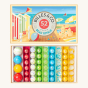 Billes & Co kids recycled glass Beau Rivage marbles set open on a white background showing the colourful marbles inside