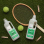 Bio-D Juniper fragranced natural, vegan friendly Laundry Liquid and Laundry Conditioner in a 1 litre bottle, on a green grassy background surrounded by tennis balls, pegs and a tennis racket