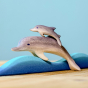 Bumbu Wooden Dolphin.  The toy is paired with a baby dolphin riding a wave.