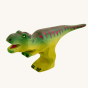 Wooden toy adult T-Rex in vibrant shades of green and purple. The T-Rex stands upright with its jaws open in a forward stance. The toy has painted teeth, claws, and eye detail.