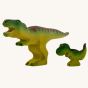 Wooden toy adult T-Rex in vibrant shades of green and purple. The T-Rex stands upright with its jaws open in a forward stance. The toy has painted teeth, claws, and eye detail. The T-Rex is accompanied by the baby T-Rex.