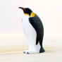 Bumbu eco-friendly childrens wooden emperor penguin figure stood on a light wooden work top in front of a white background