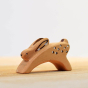 Close up of the Bumbu wooden running rabbit toy figure on a wooden worktop